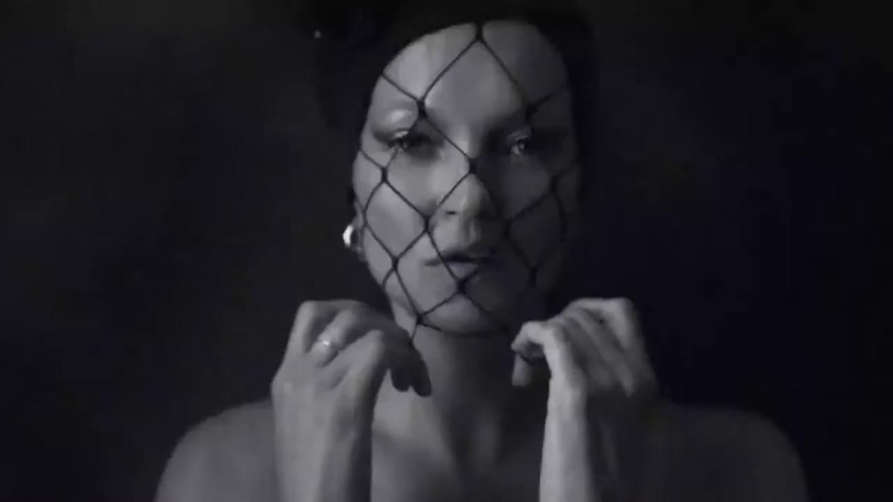 Kate Moss in a veiled hat, photographed in black and white for Beauty Papers